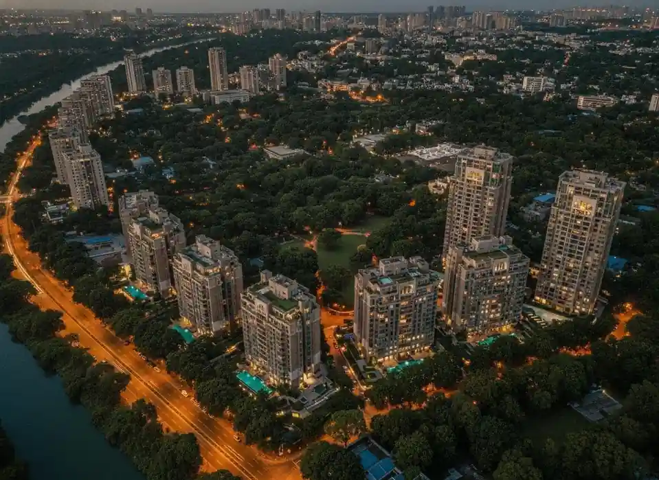 Koregaon Park Pune luxury residential area with green trees and modern buildings